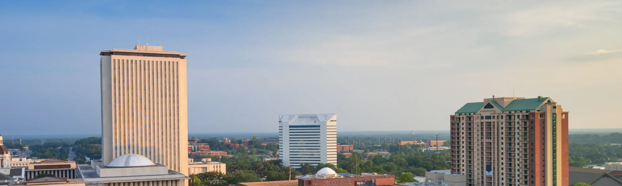 Downtown Tallahassee skyline with the Florida State Capitol tower and historic brick buildings
